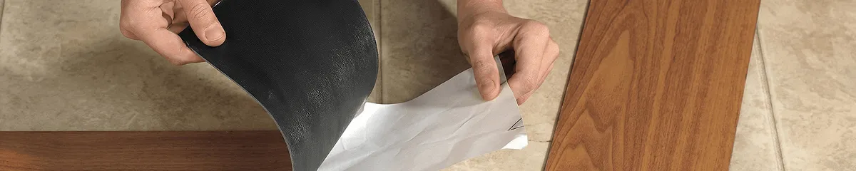 A professional installing vinyl flooring in Little Rock, AR